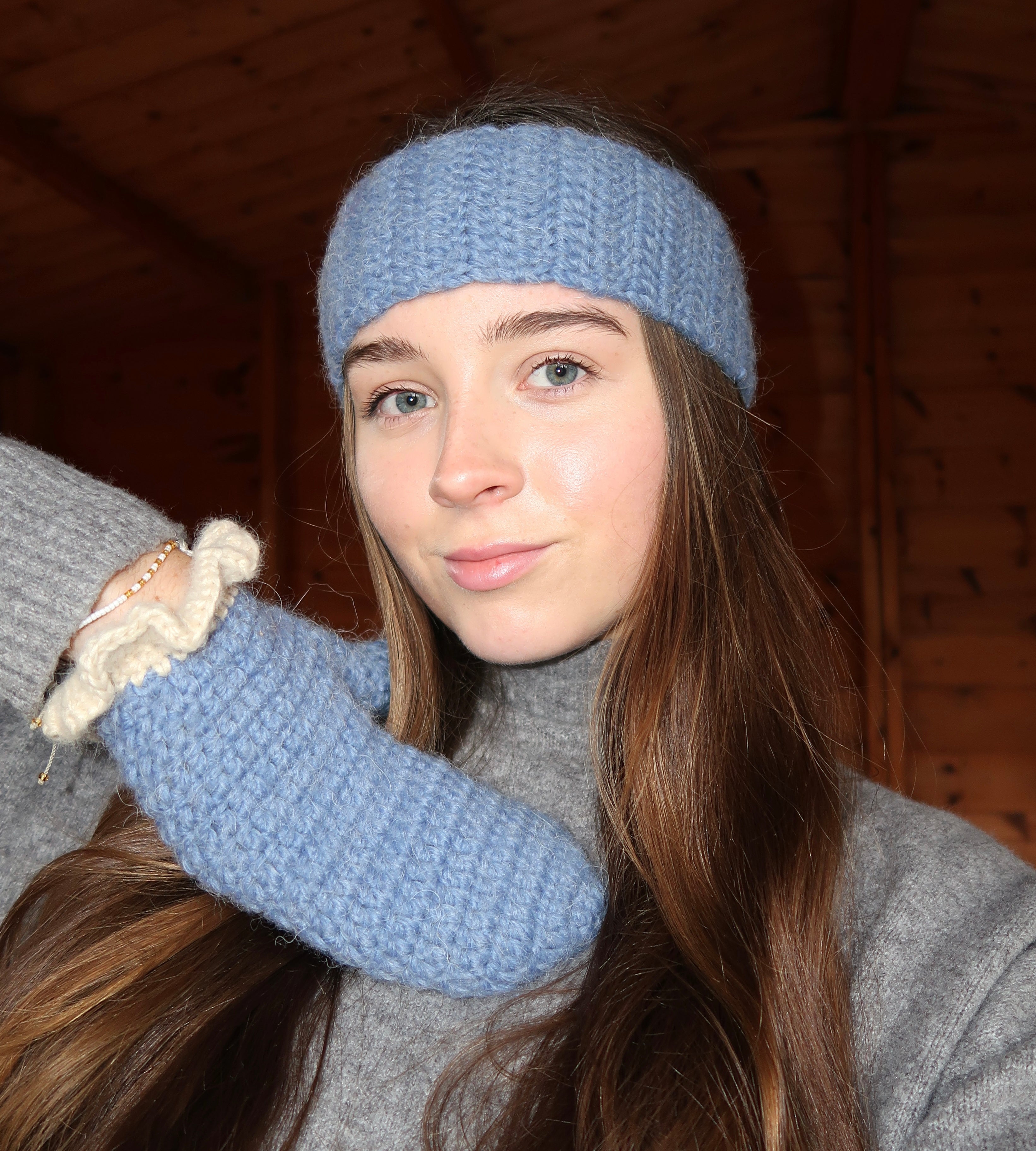 Blue crochet mittens with cream frill