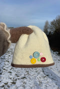 Cream and brown button beanie